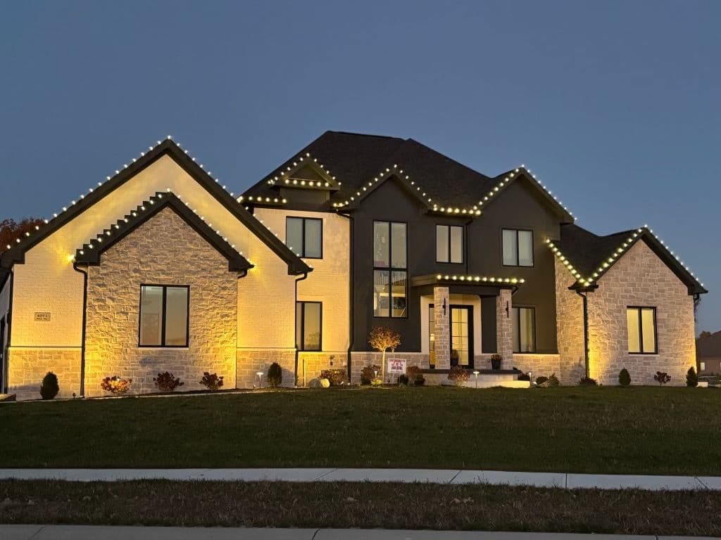 Modern house featuring elegant outdoor lighting at dusk, showcasing architectural design.